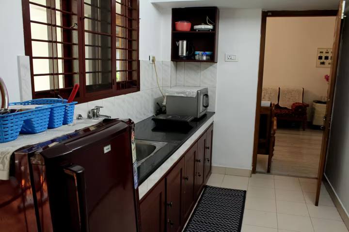 Kitchen with fridge and microwave