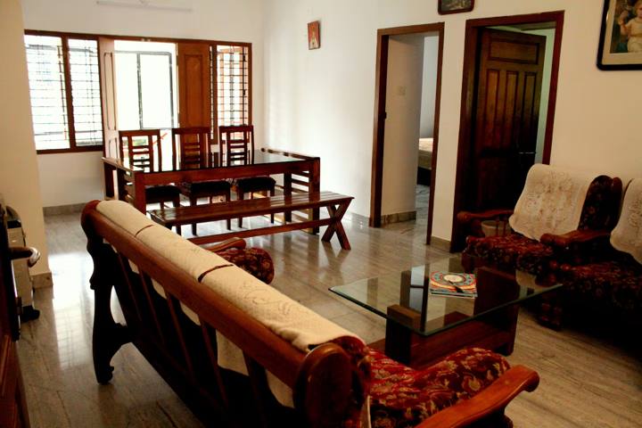 Bungalow lounge with wooden sofa set and dining table